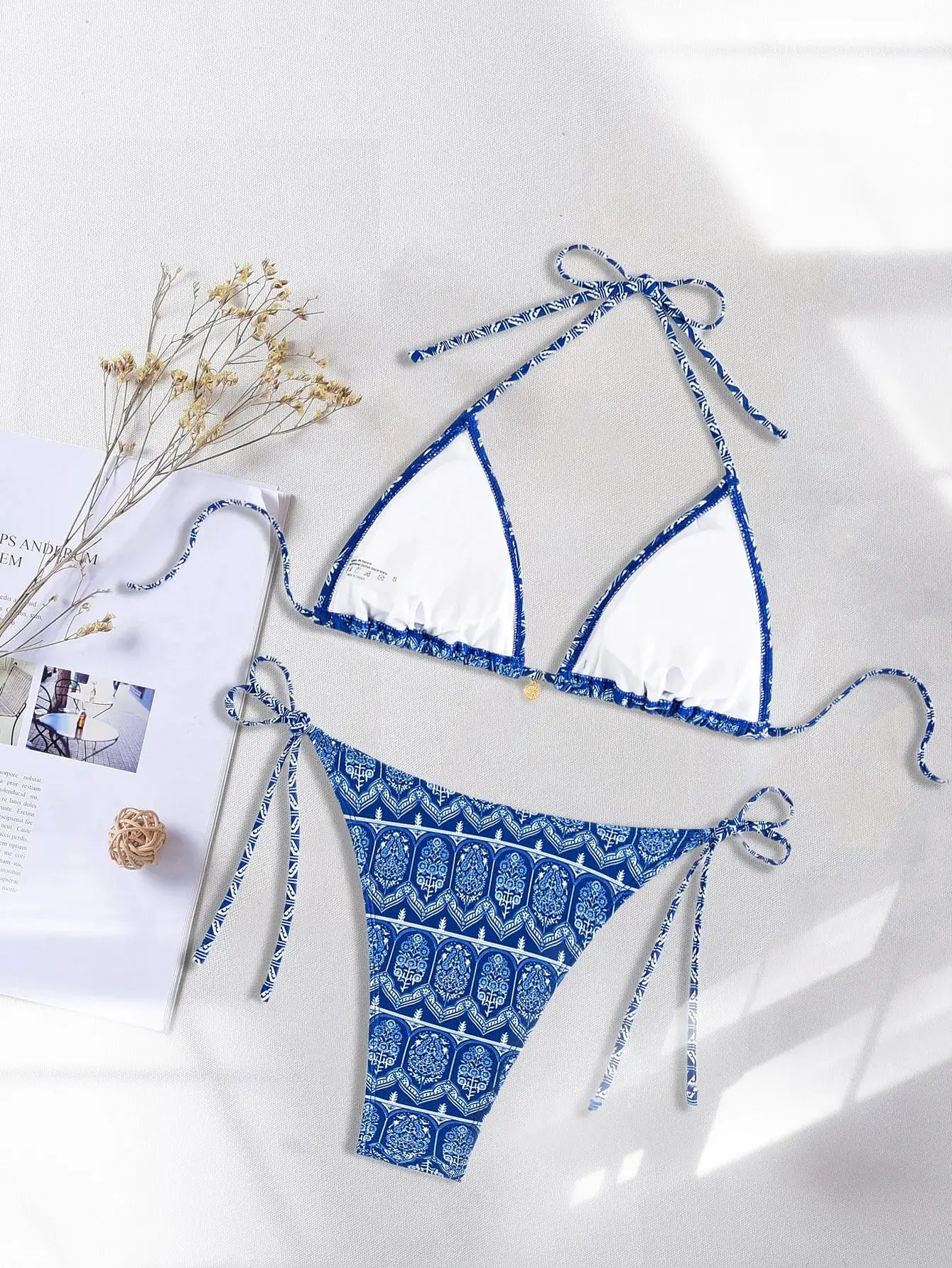 Triangle bikini set by Simples Market in blue and white floral print; push-up top with white cups and Brazilian bottoms.