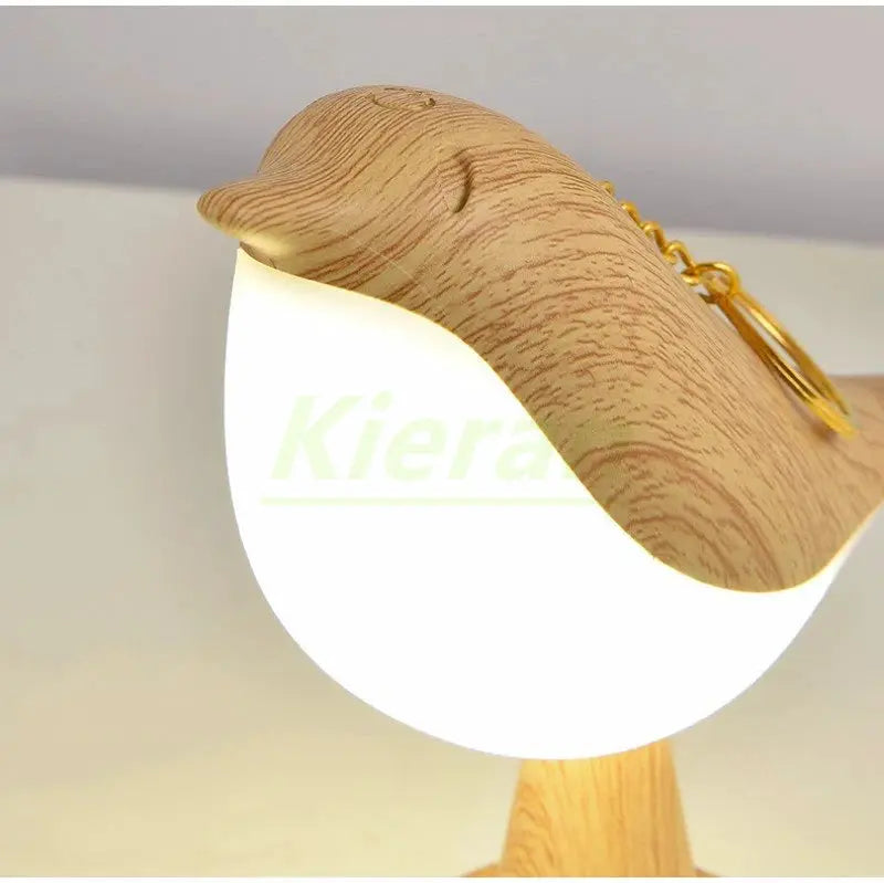 Nordic Magpie LED desk lamp with natural wood bird accent and white glass shade