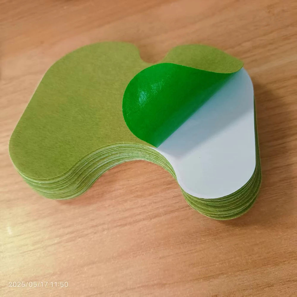 Heat patches 120pcs bundle, green top sheets with white backing, stacked in a curved pile.