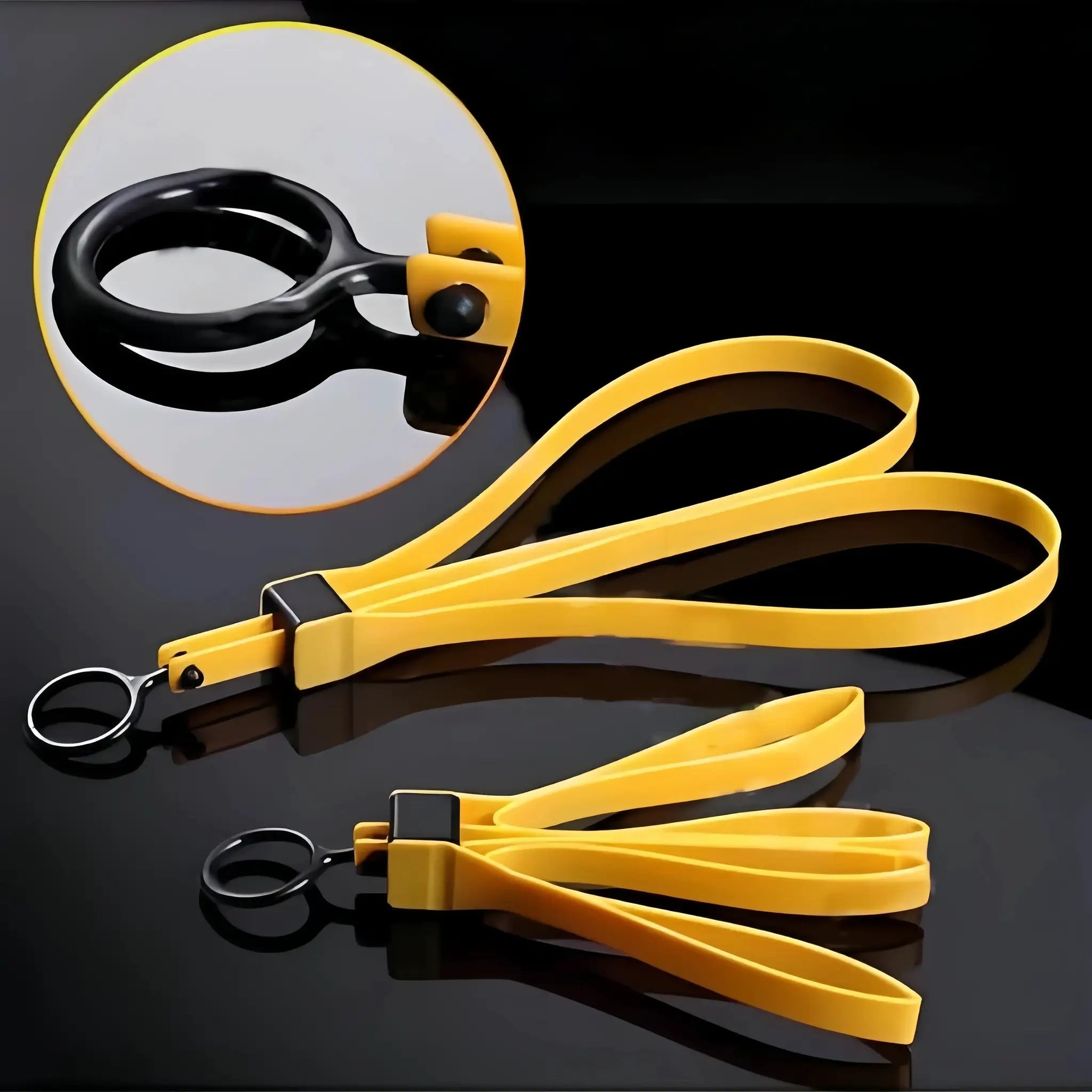 Disposable yellow plastic handcuffs with black locking mechanism and metal rings.