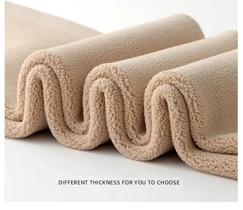 Beige fleece fabric roll with soft plush texture and thickened material, shown in folded curves