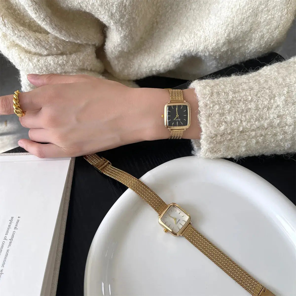 Gold-tone women's quartz wristwatches with square-faced dials and stainless steel mesh bands; two watches shown