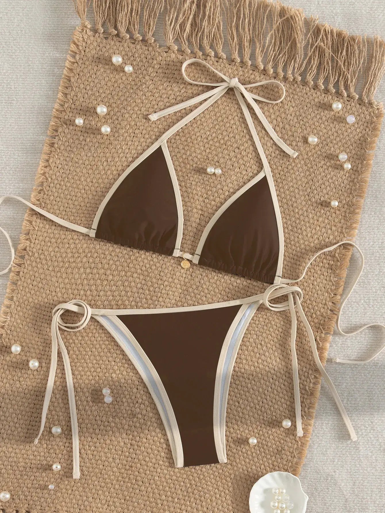 Bikini set (two-piece) by Simples Market, brown color-block triangle top with beige trim and tie sides, matching high-cut bottoms