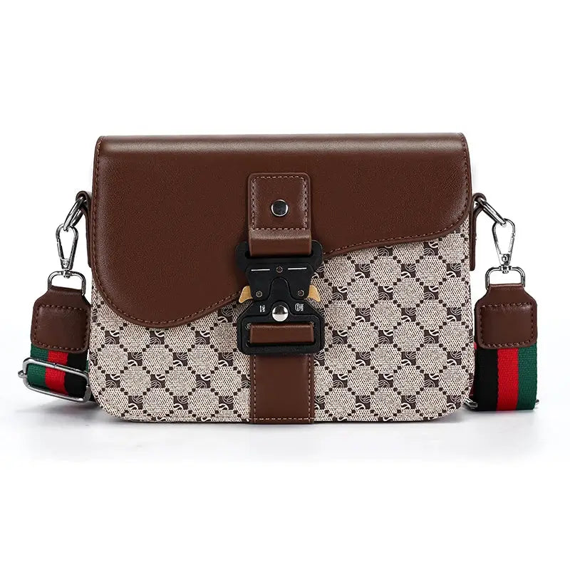 Crossbody bag with brown leather flap and beige jacquard body; adjustable striped strap.