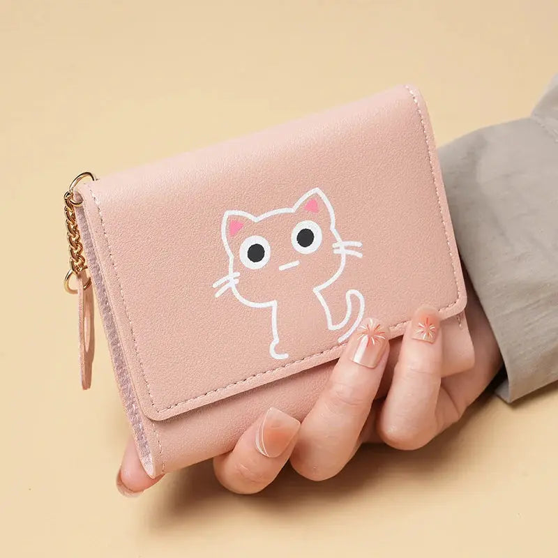 Wallet in pink faux-leather with a white cat illustration and multiple card slots