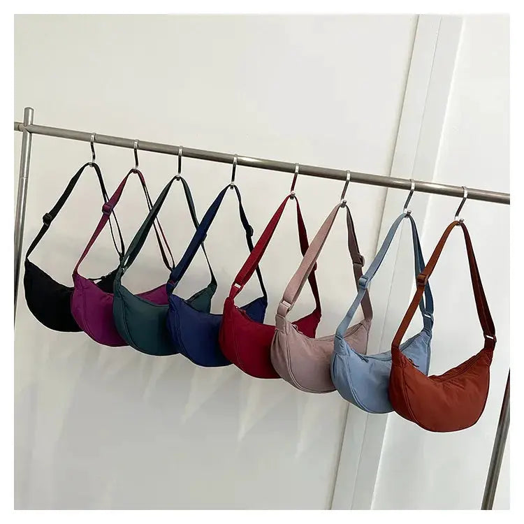 Nylon crossbody crescent dumpling bag by Simples Market, nine colors on display; large-capacity, unisex