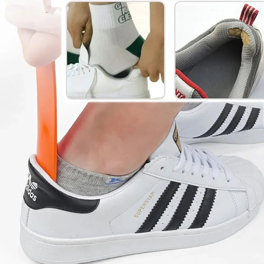 Shoe horn with orange plastic handle and spoon-shaped head for slipping into Adidas sneakers