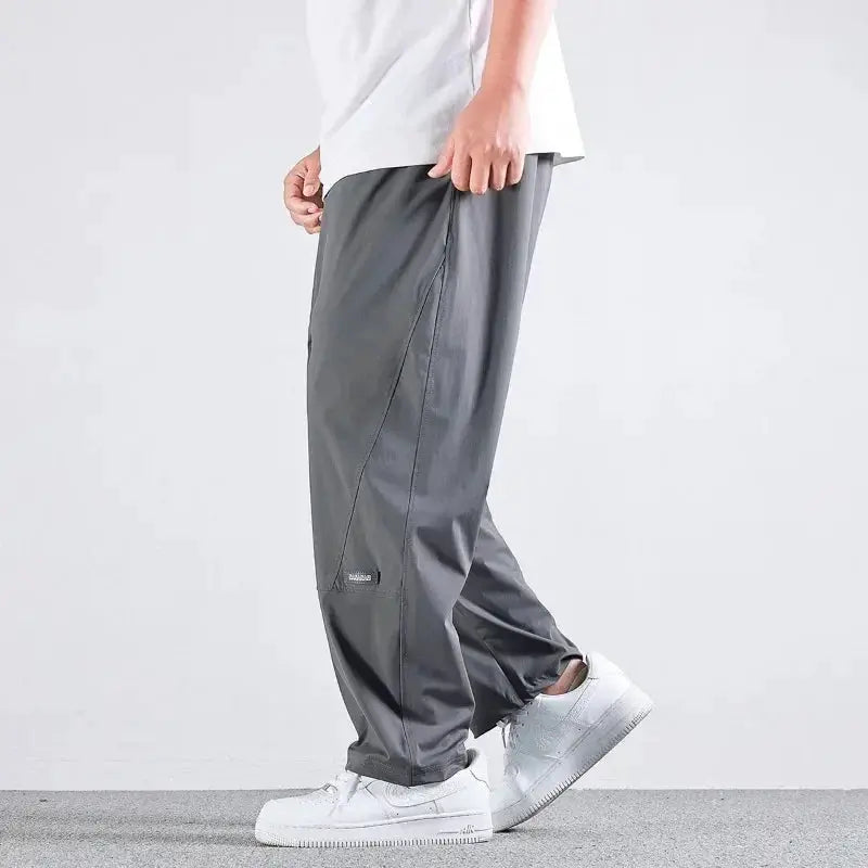 Simples Market 10XL Casual Pants for men, gray straight loose joggers with elastic waist and quick-dry fabric.