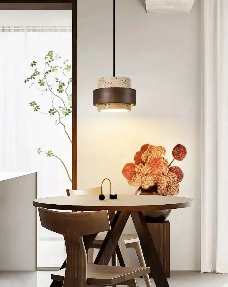 Japanese Wabi Sabi bar pendant lamp with cream speckled shade and dark brown band over a round wooden dining table