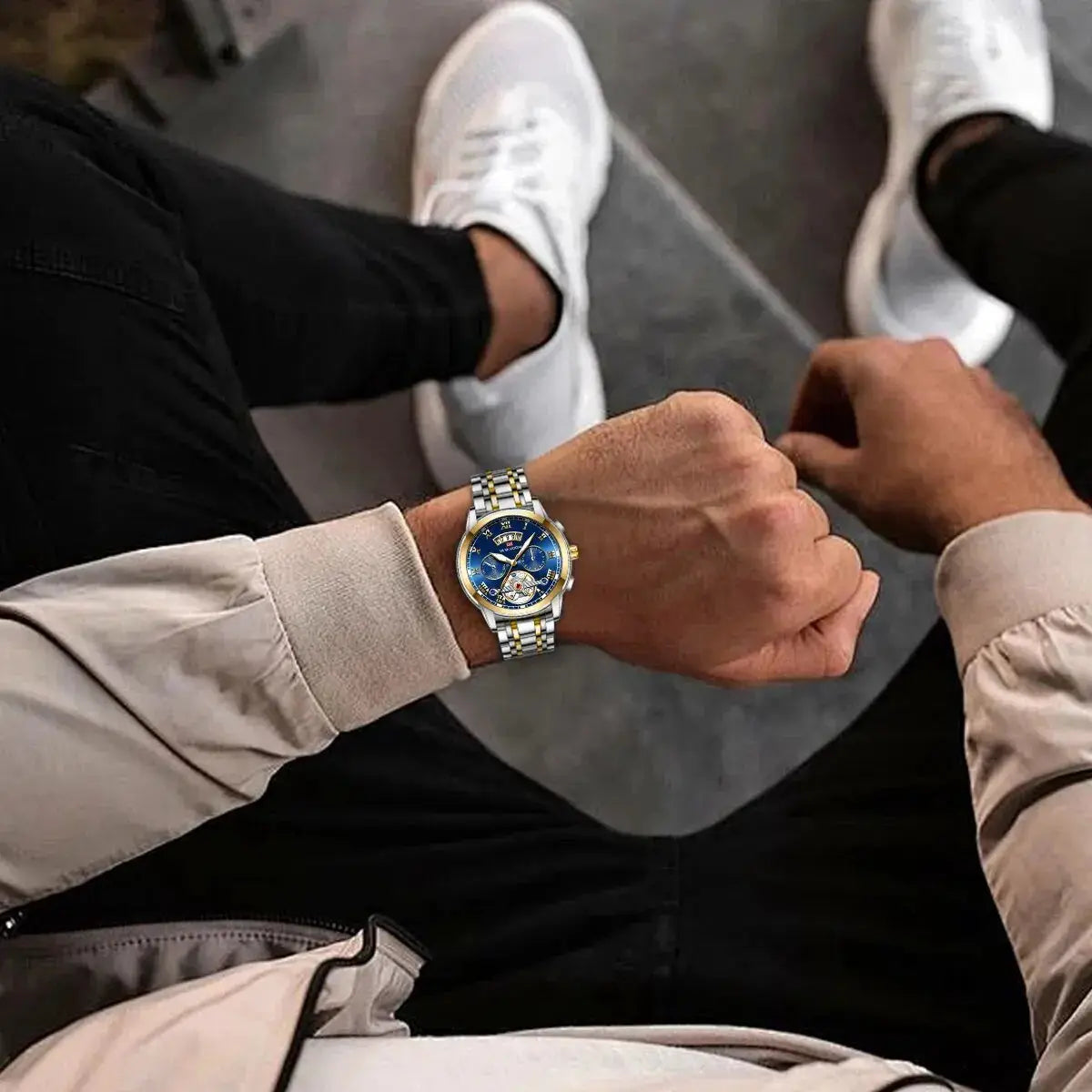 Men's luxury stainless steel watch with blue dial and two-tone gold and silver bracelet.