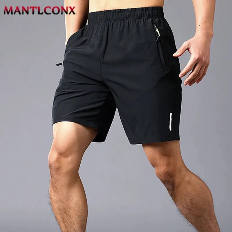 Men's black athletic shorts with elastic waistband and zipper front pocket.
