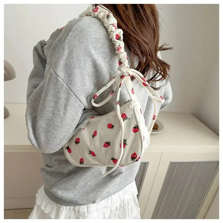 Simples Market corduroy underarm bag with strawberry print, small half-moon tote