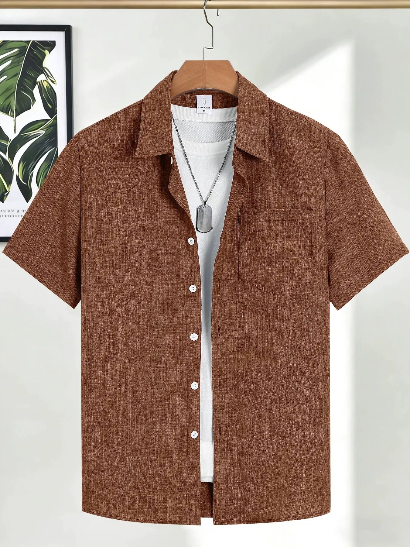 Men's casual linen short-sleeve shirt in rust brown with textured weave, shown layered over a white tee