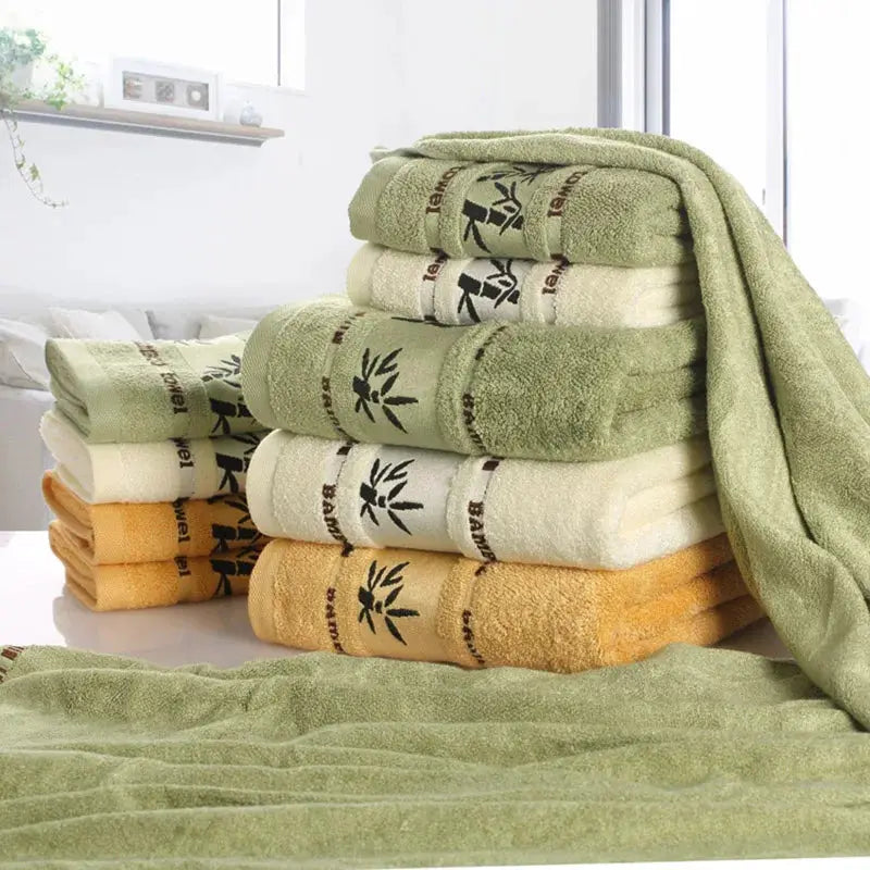 Bamboo fiber towel set with multi-color bath, hand, and face towels in green, cream and orange.