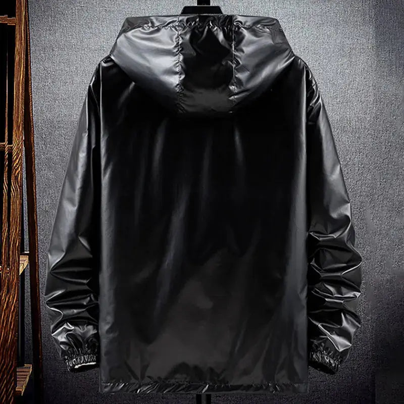 Men's shiny black hooded bomber jacket with lightweight waterproof fabric