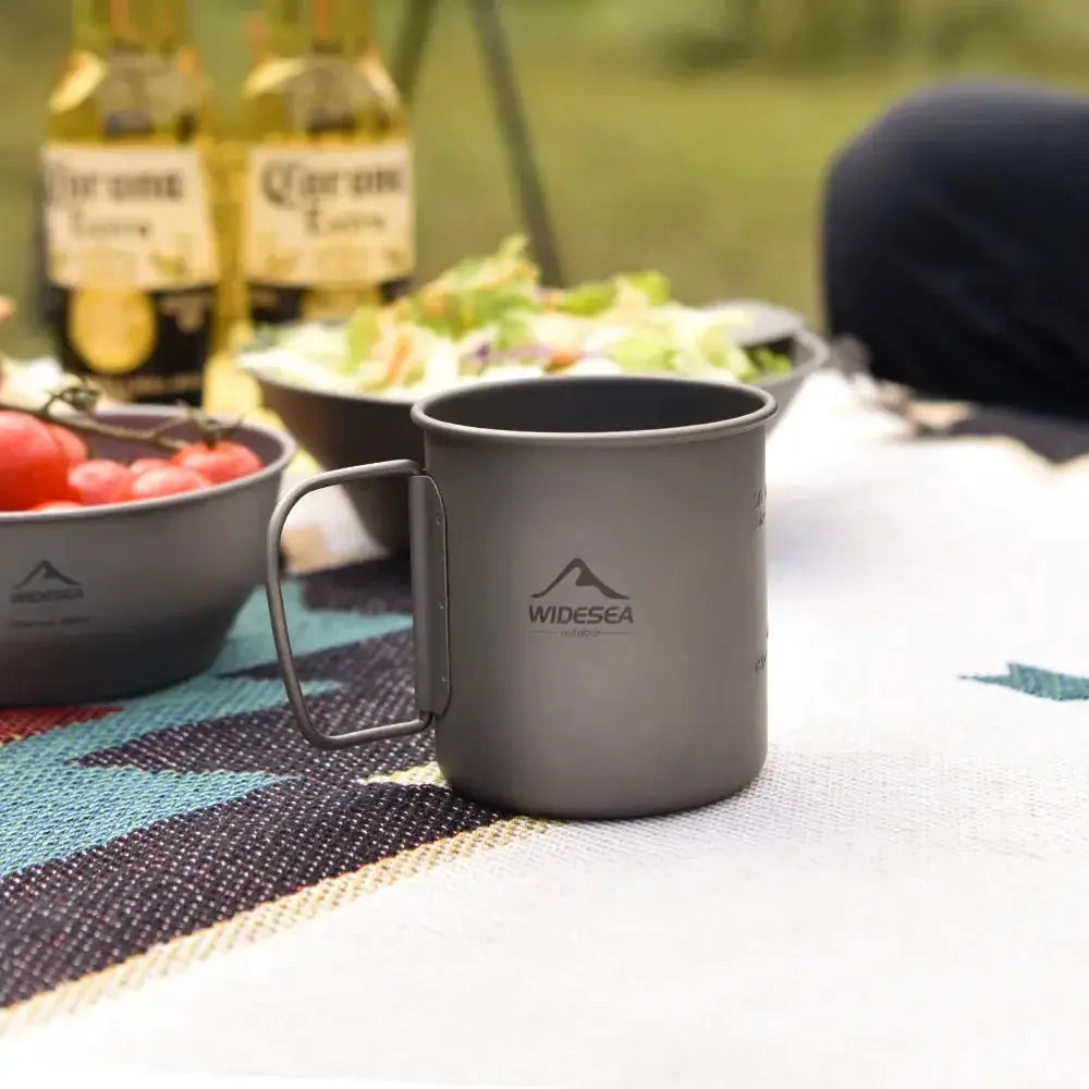 Widesea titanium camping mug with handle and logo, gray outdoor tableware for picnics.