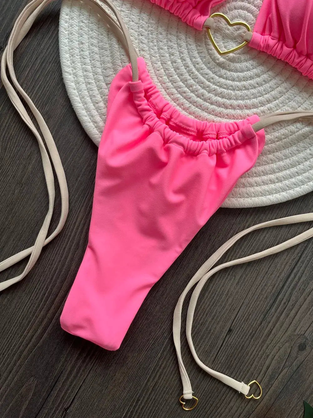 RUOTONSEPT pink halter bikini set with thong bottom; beige straps, shown with a white woven hat