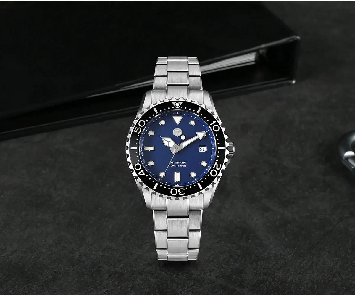 San Martin diver watch with blue dial, 40–44mm case, stainless steel bracelet, and black bezel