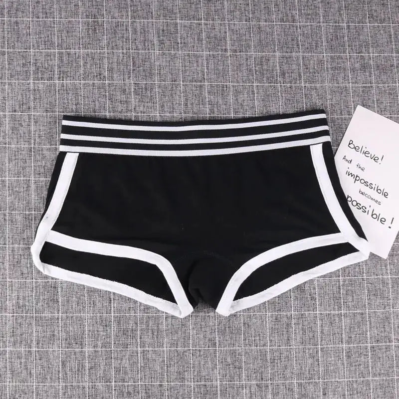 Women's black low-waist boxer shorts with white trim and striped waistband