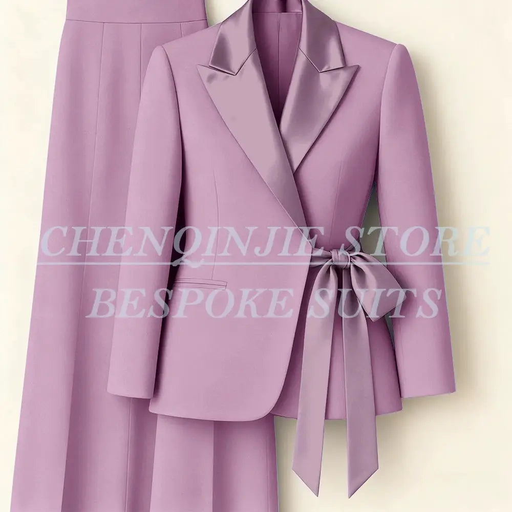 Women's pink blazer pants suit with peak lapels and waist belt, two-piece office set by Simples Market