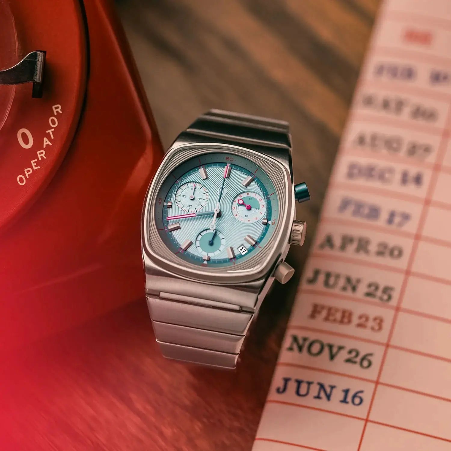 Men's stainless steel chronograph watch with turquoise dial and metal bracelet