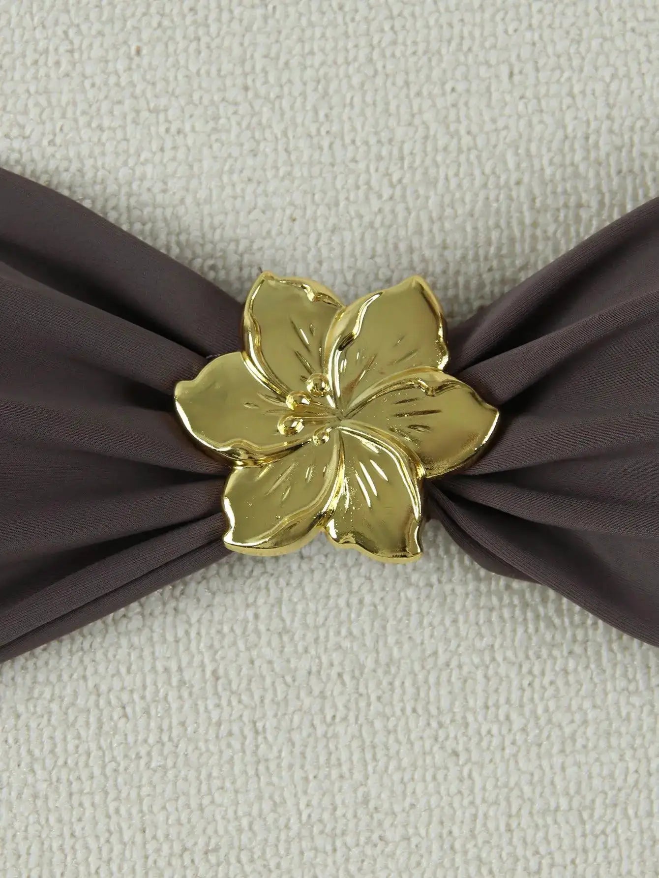 Bandeau bikini with brown fabric and large gold flower centerpiece by Simples Market