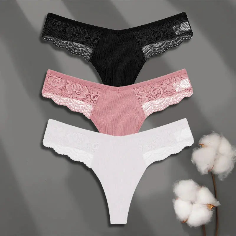 Three-pack lace-trimmed thong panties in black, pink, and white; low-rise bikini style.