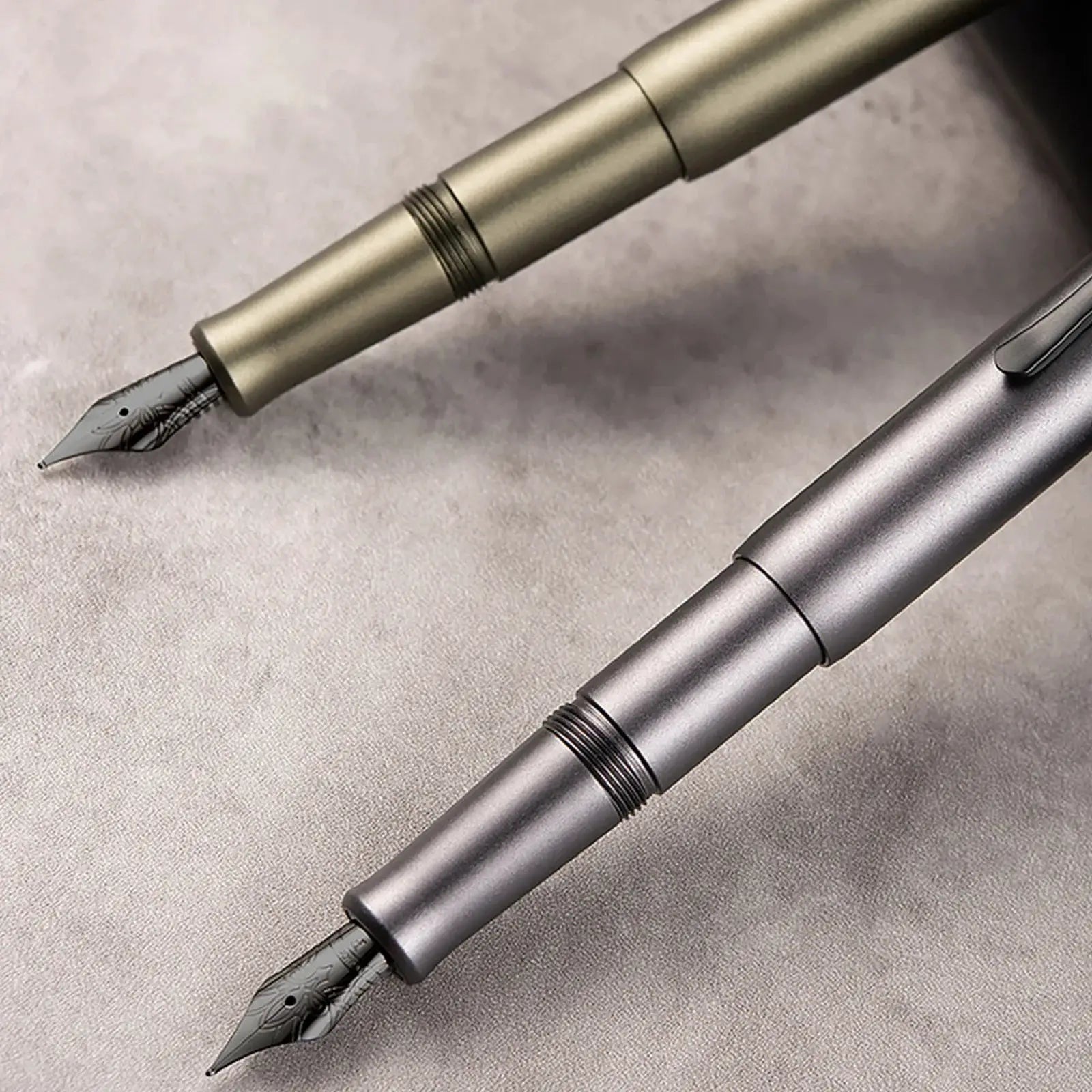 Two Hongdian M2 fountain pens by Simples Market in bronze and silver finishes with EF/F nibs