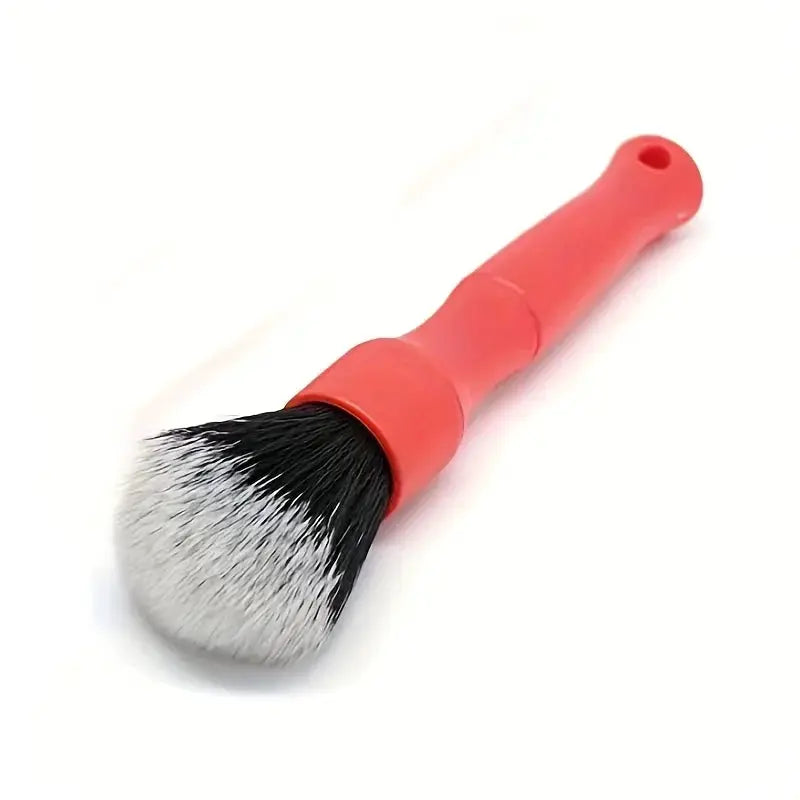 Car detailing brush by Simples Market, pink handle with black and white synthetic bristles