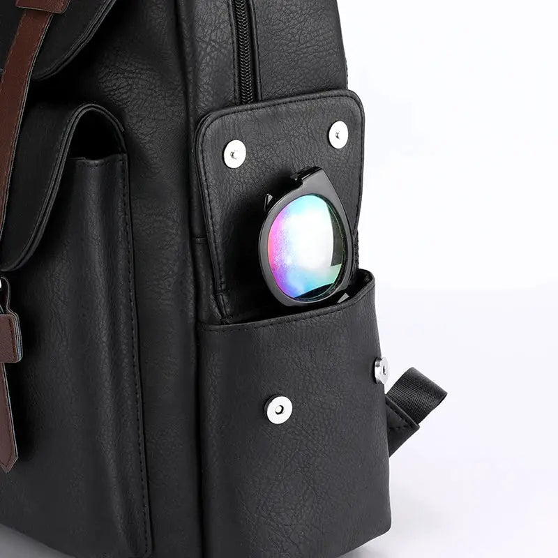 Men's PU leather laptop backpack, black with front pocket holding sunglasses