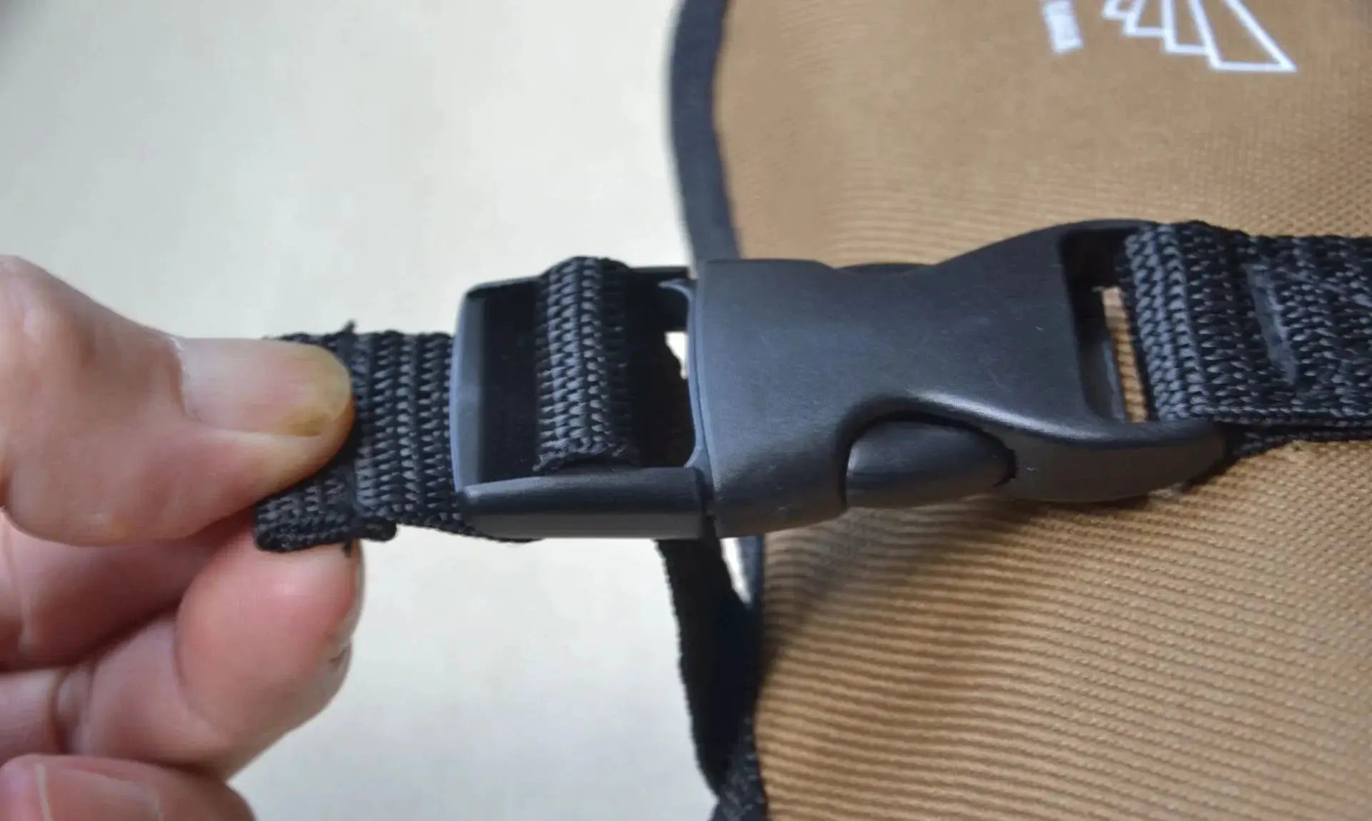 Tan Oxford cloth roll tool pouch with black strap and buckle