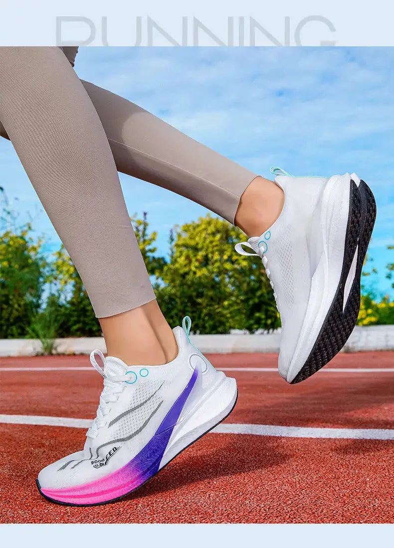 Marathon running shoes, white upper with purple side stripe and pink-to-purple gradient sole, lightweight.