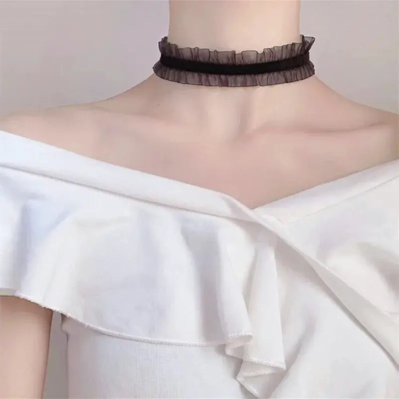 Lace choker necklace for women, black with sheer ruffle and velvet band.