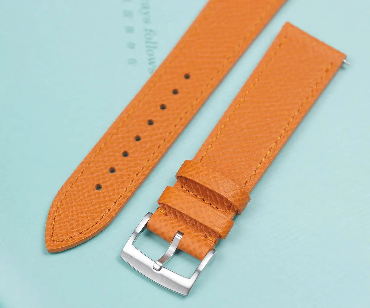 Watch strap pair: orange leather straps with brushed stainless steel buckles for Cronos GS mechanical watch.