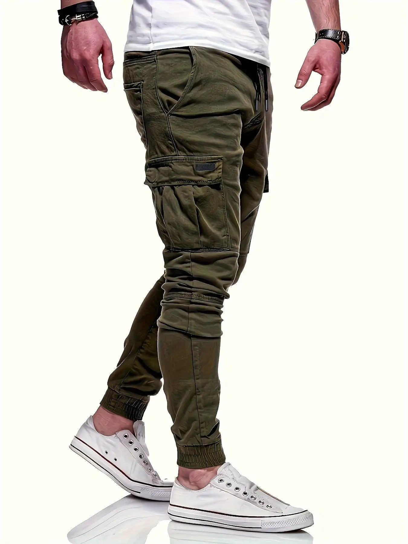 Men's olive green loose cargo work pants with drawstring waist, multiple pockets, and elastic cuffs.