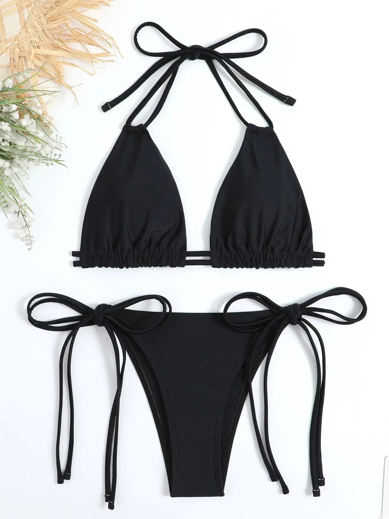 Two-piece black bikini set with halter triangle top and multi-strap side-tie bottoms