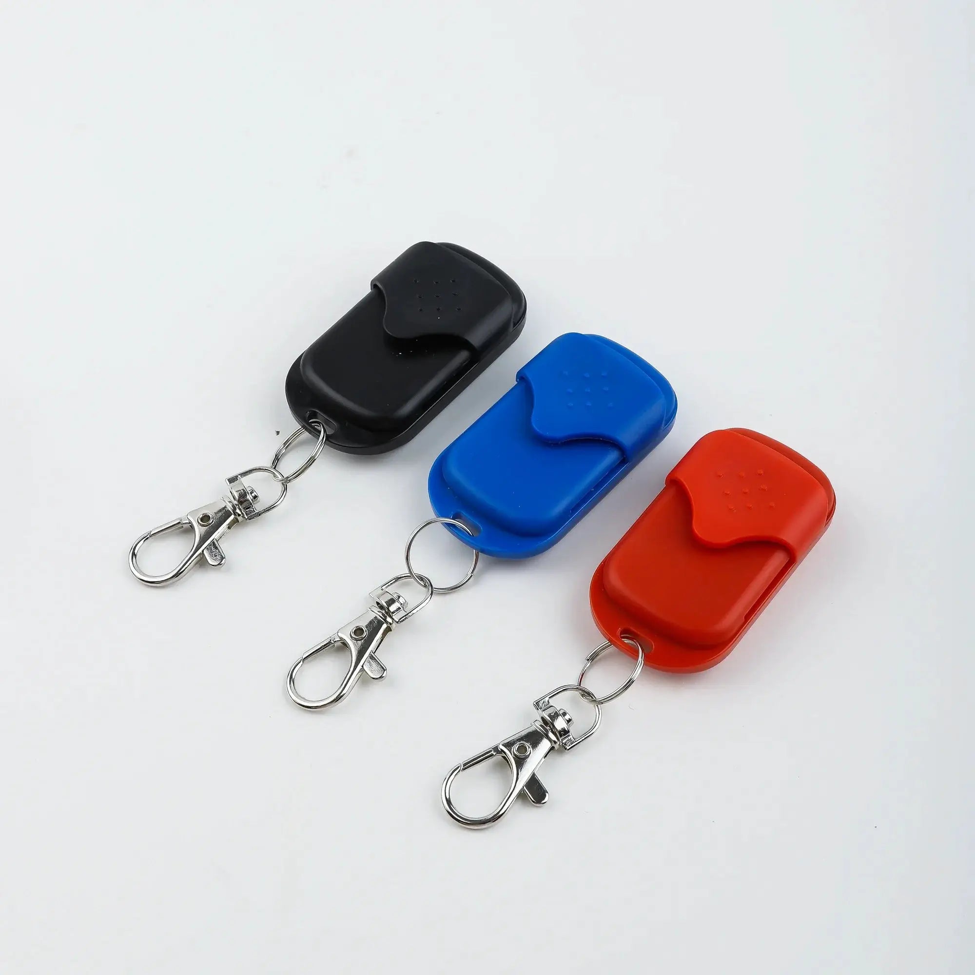 Universal garage door opener remote fob set of four silicone key fobs with metal keychains in black, blue, orange, red