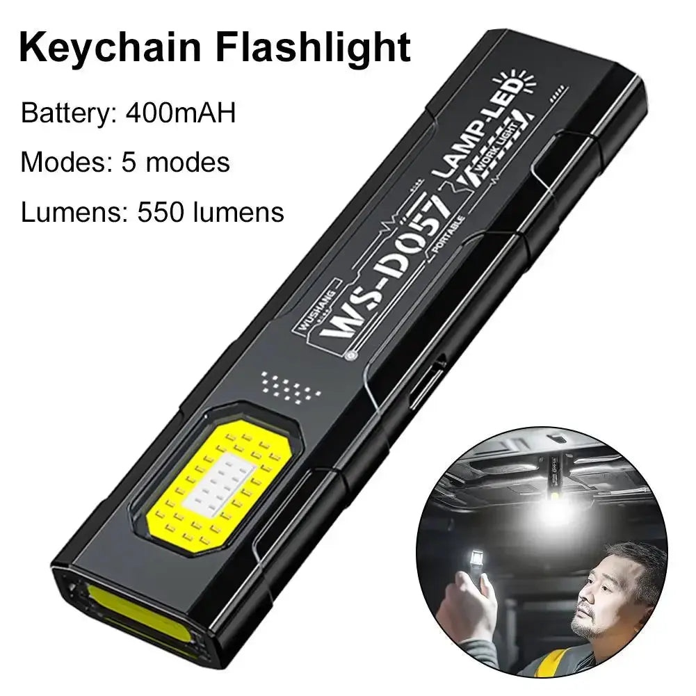 Simples Market keychain flashlight, USB-C rechargeable mini COB LED pocket light, black with yellow LED panel.