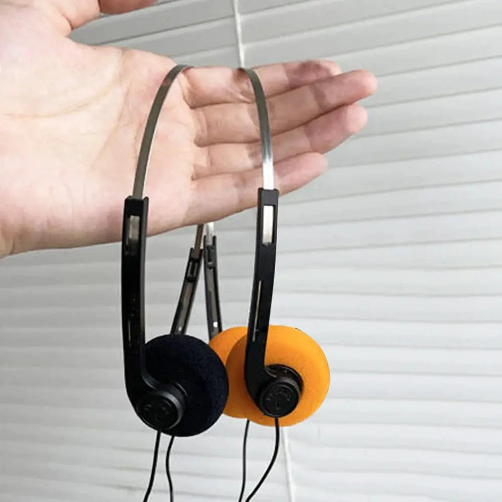 Simples Market on-ear wired stereo headphones with orange and black foam pads and adjustable headband, 3.5mm plug