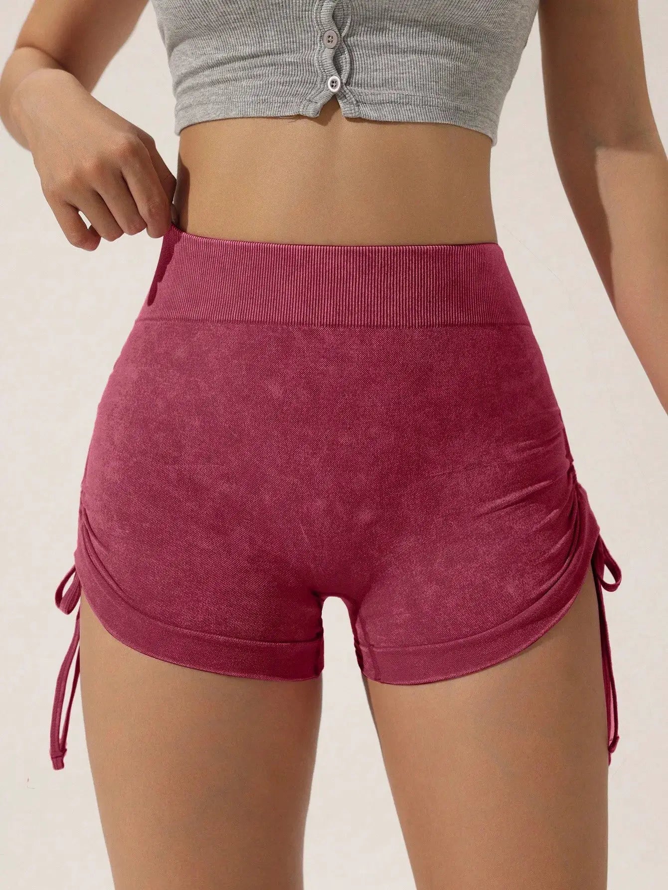 Drawstring frosted shorts for women in pink with a wide ribbed waistband and side ties
