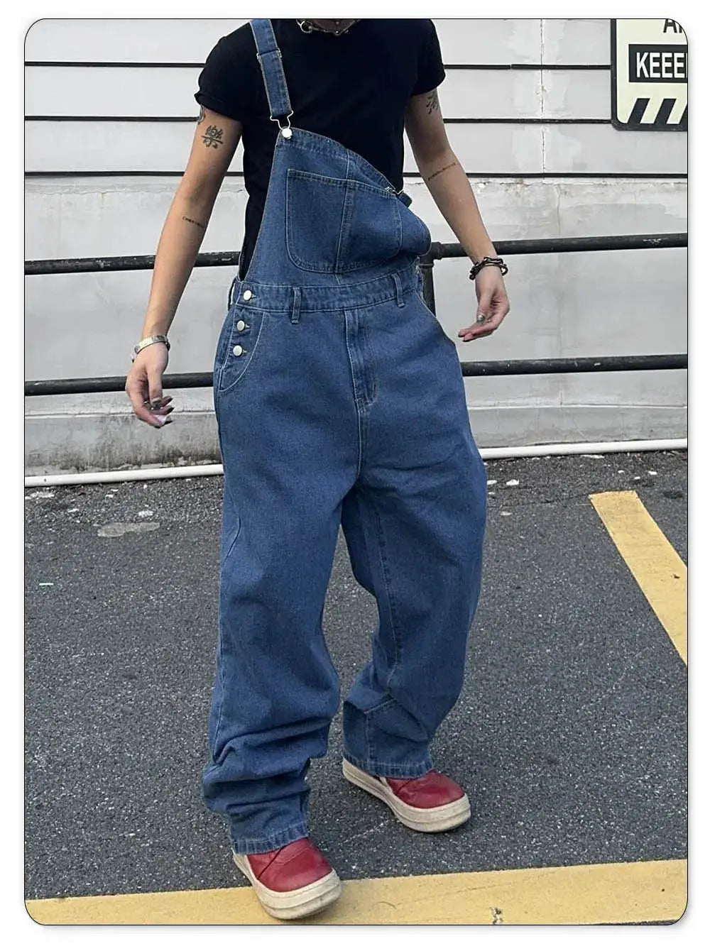 Men's denim overalls with a single suspender, baggy mid waist, washed blue