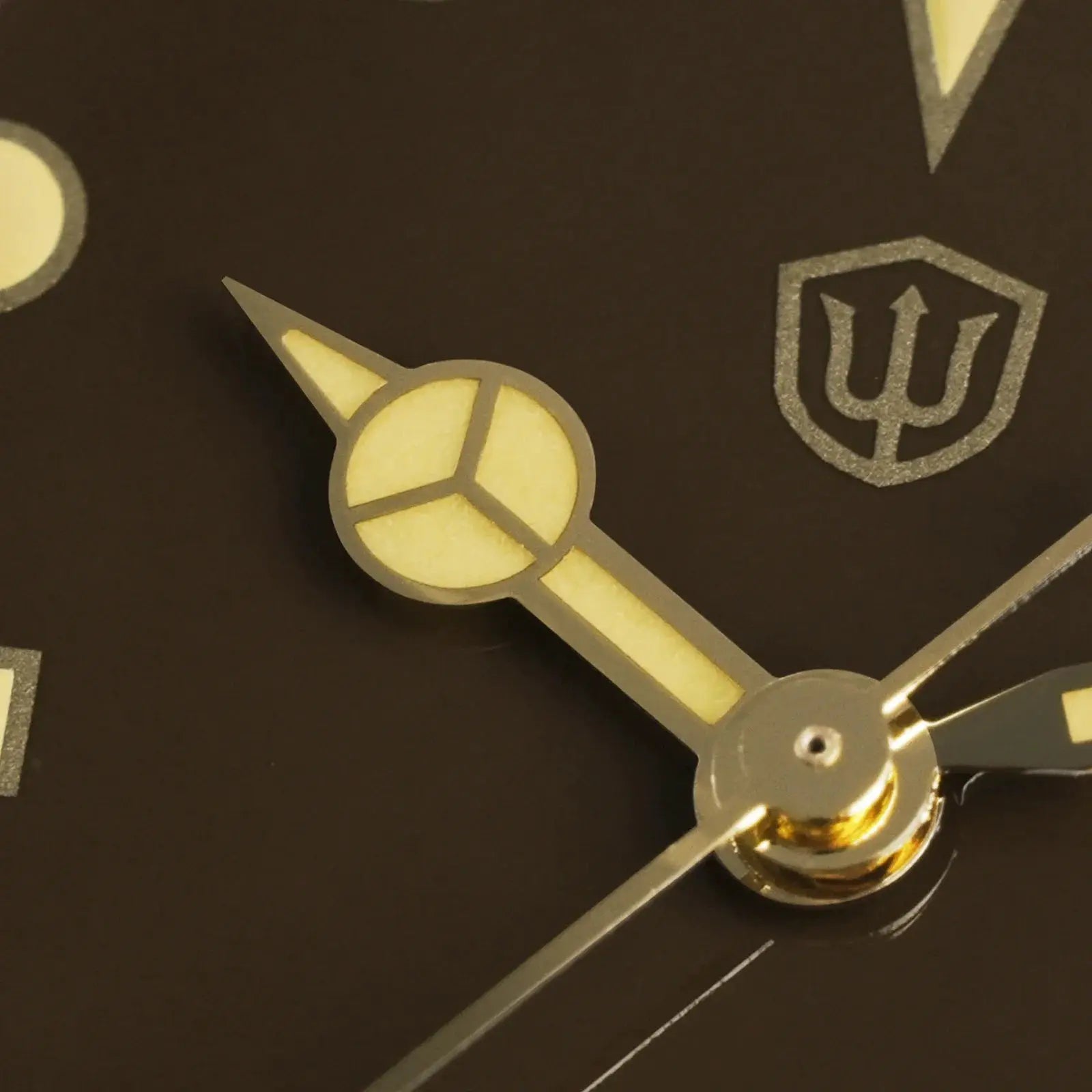 Watchdives WD7922 BB54 watch movement close-up with silver hands and yellow lume on a dark dial; shield logo visible