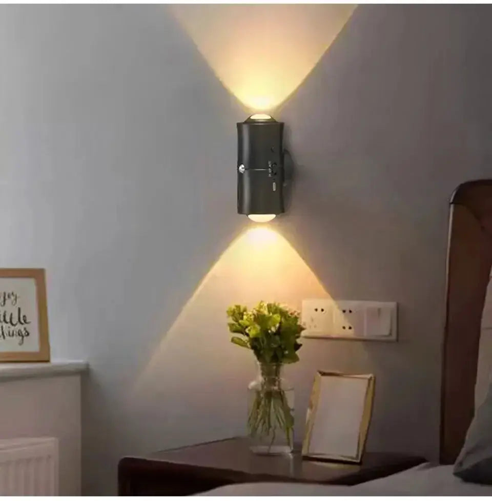 Motion sensor LED wall light with dual heads, black finish, RGB rechargeable ambient lighting