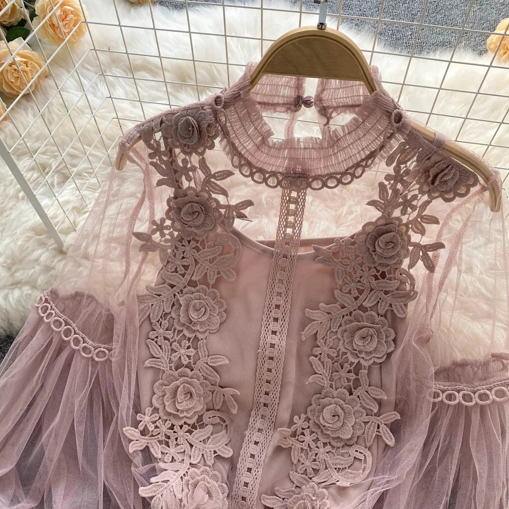 Lace puff long-sleeve blouse in soft pink-lavender with floral appliqué and sheer overlay