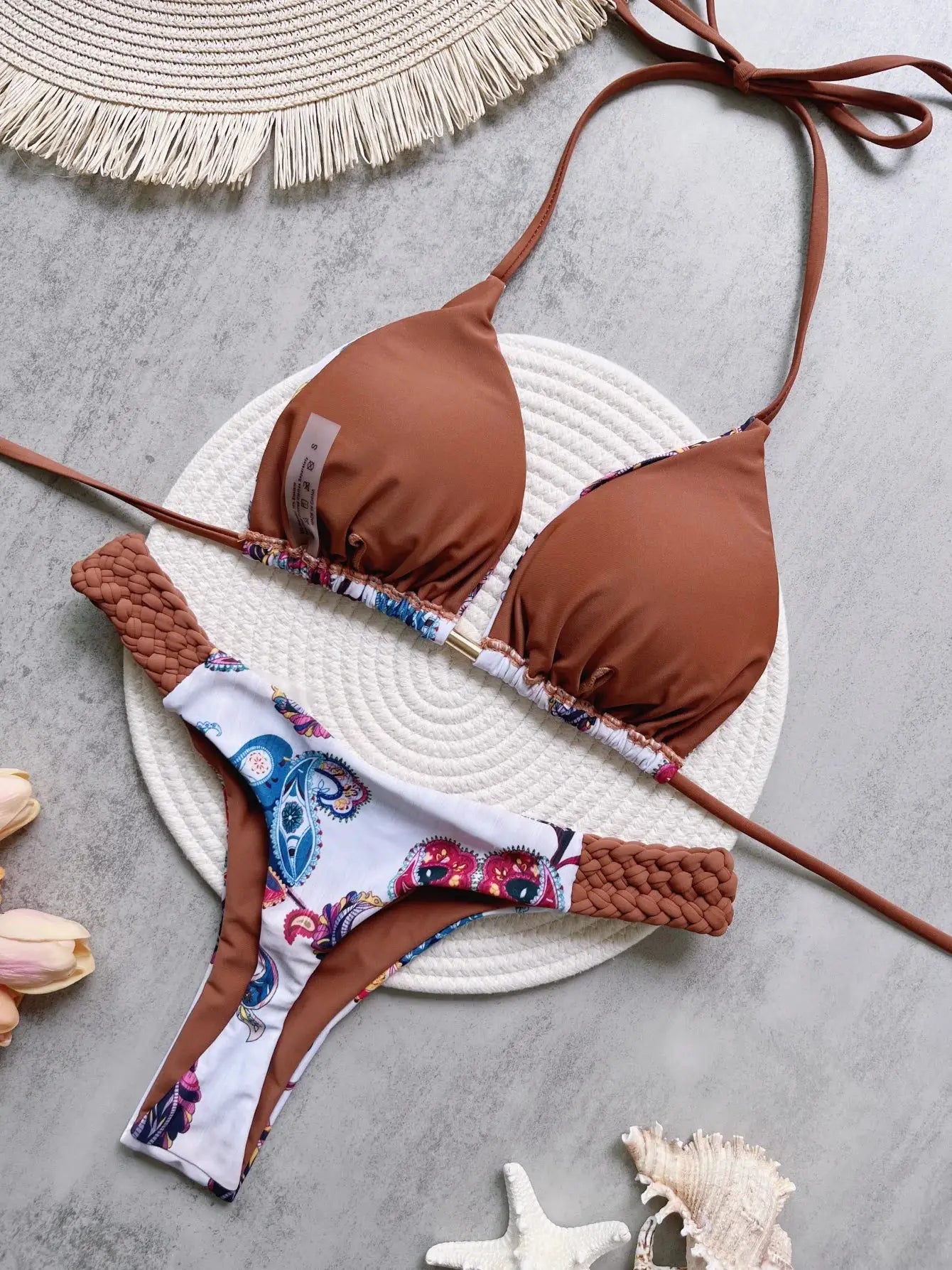 RUOTONSEPT halter bikini top and paisley-print bottom; rust brown cups with colorful trim, Simples Market.