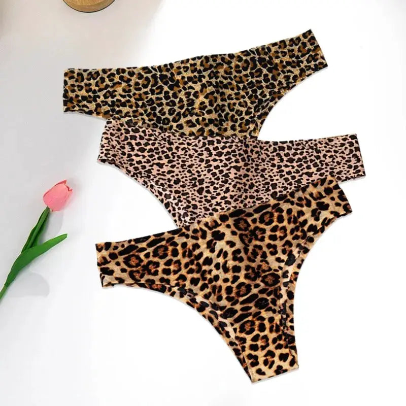 3-pack leopard print women’s thongs; seamless ice-silk panties in brown, pink, and tan.