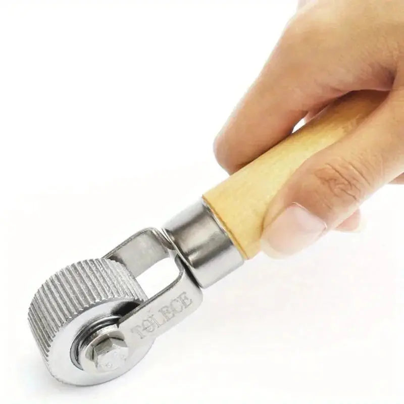 Simples Market tire repair roller with wooden handle and knurled metal wheel