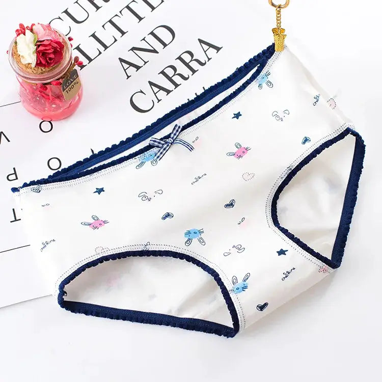 Women’s cotton seamless panties with cute cartoon bunny print and navy trim.