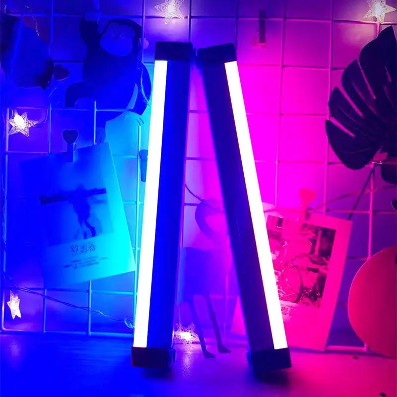 Colorful RGB LED night lamps, two rechargeable vertical bars glow blue and pink for bedroom mood lighting.