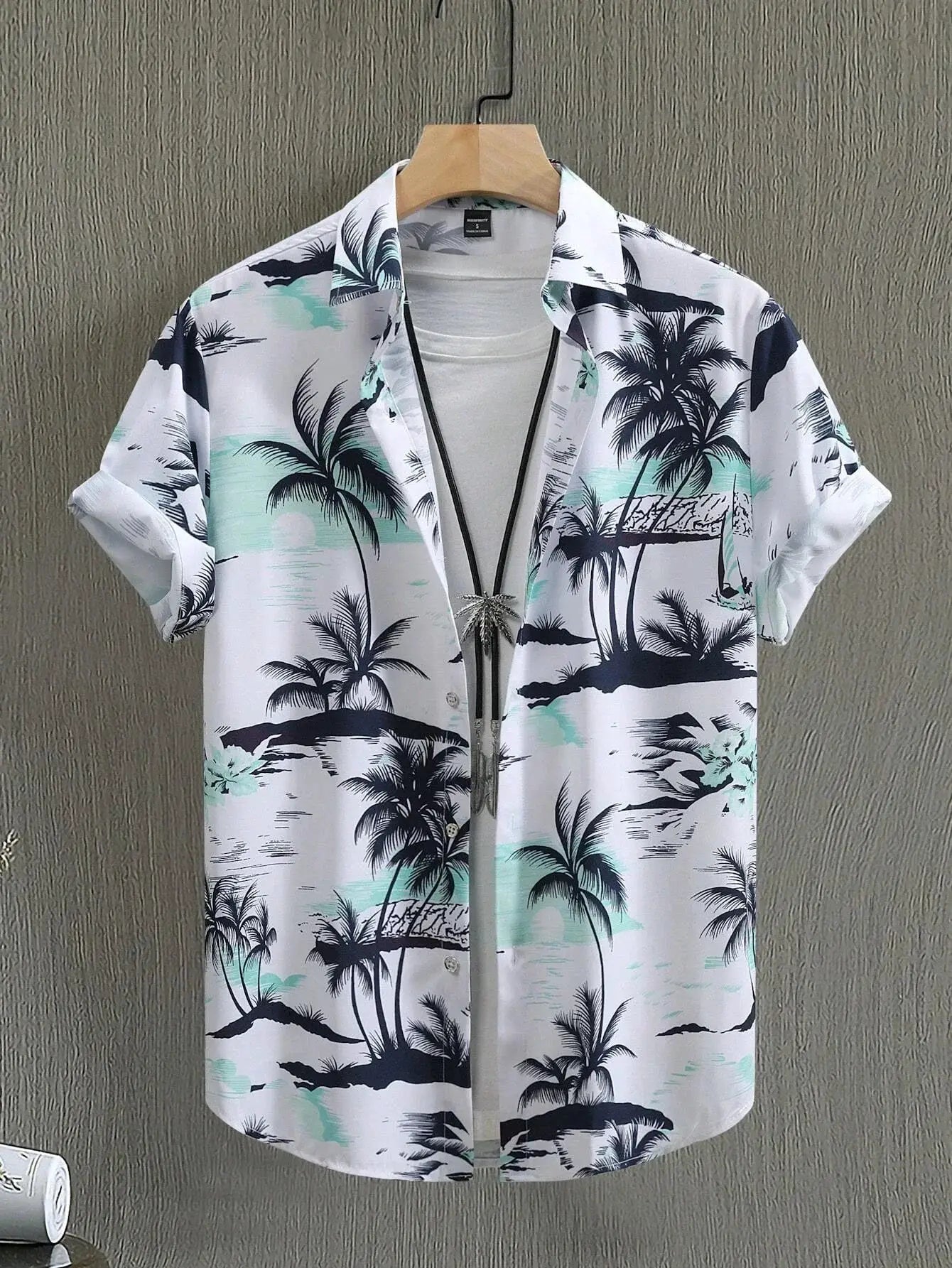 Hawaiian shirt by Simples Market, white base with teal and navy palm tree print, short sleeves